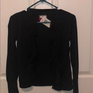 New with tags is open with  front ruffles